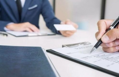 Business meeting with documents and pen.
