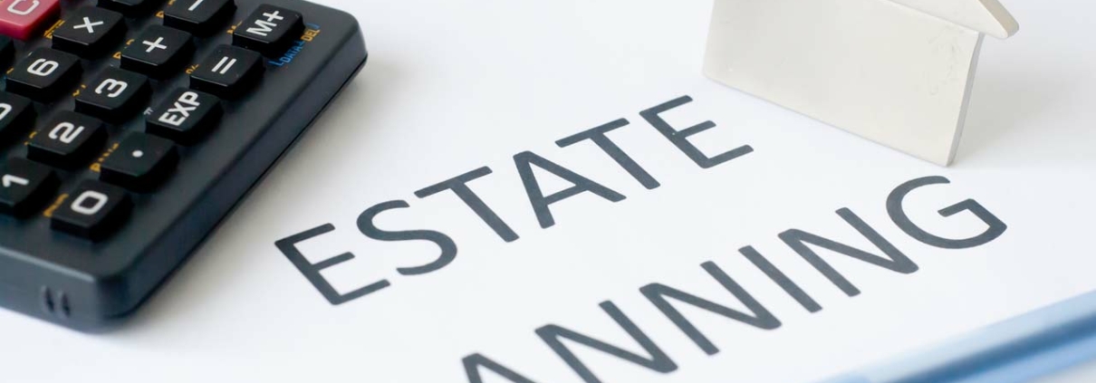 Estate planning document with calculator and pen.
