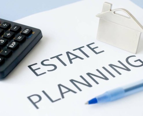 Estate planning document with calculator and pen.
