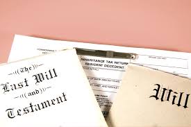 Wills and tax return documents on table.