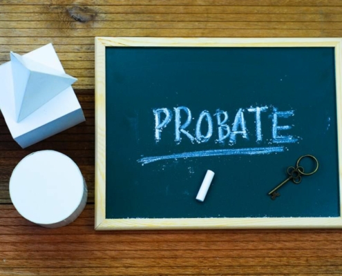 Chalkboard with "Probate" written, key beside.