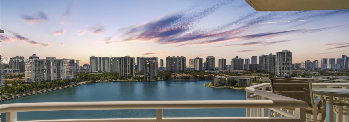 Balcony view of marina and city skyline.