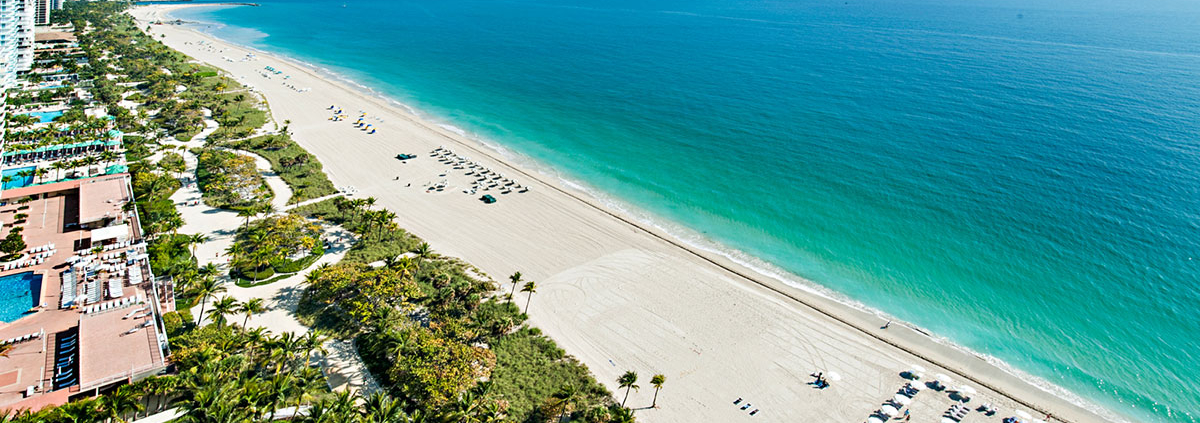 Aerial view of beach and ocean coastline.
