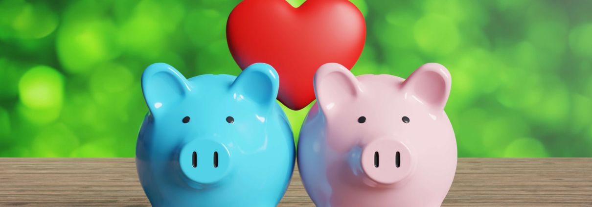 Blue and pink piggy banks with heart.