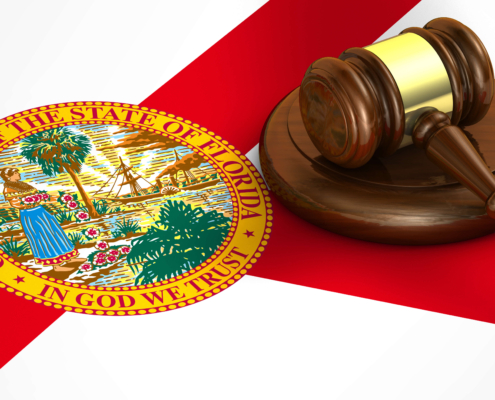 Florida state seal and gavel on flag.