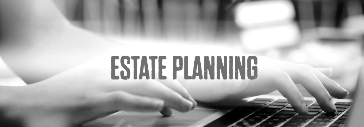 Hands typing on laptop, estate planning text.
