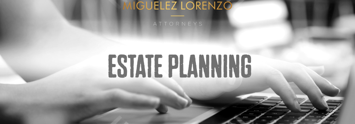 Hands typing on a laptop, estate planning.